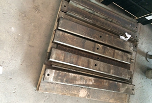 Toggle plate shim